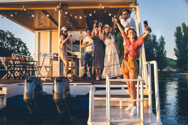 istock group of friends having fun on a boat at sunset 1682177735