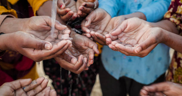 istock Hands of poor - Indian children asking for drinking water 1682183861