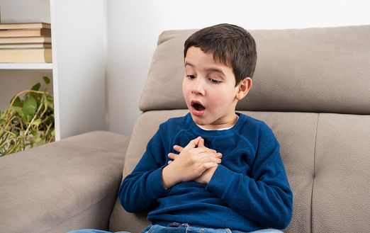 Child suffering an anxiety attack alone at home