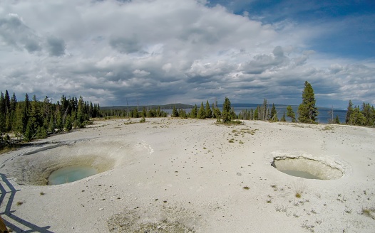 A view of Yellowstone National Park's West Thumb Geyser Basin with geothermal pools