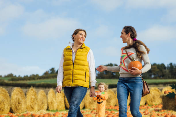 istock Mothers at the Pumpkin Patch 1682249861