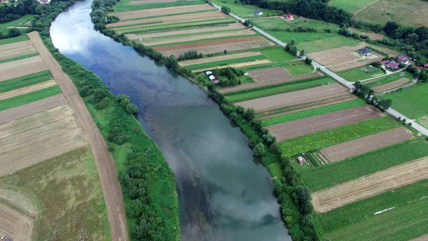 istock Aerial Of River Fields And Highland Landscape 1682254373