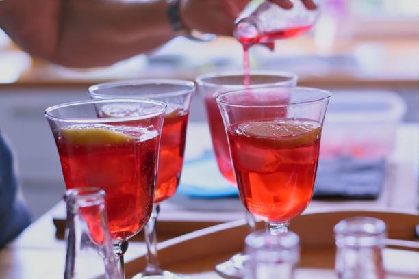 istock filling of glasses with red aperitif 1682256538