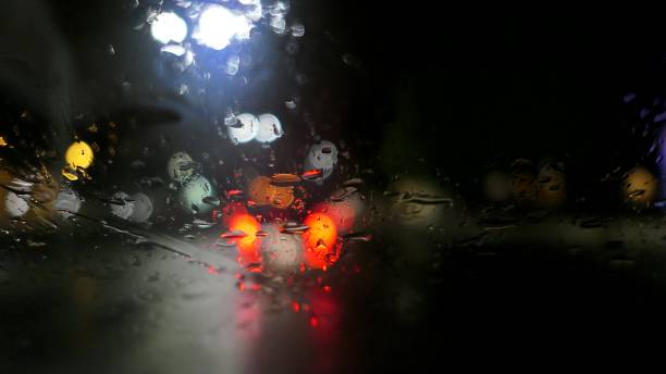 istock Fast Motion Dash Cam Night City Lights In Rain POV 1682264469