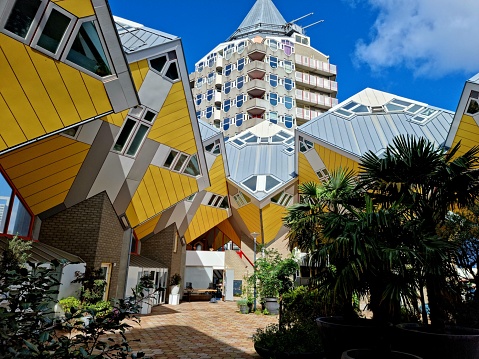 Cube houses are a innovative houses built in Rotterdam in the Netherlands, designed by architect Piet Blom. The buildings where completed in 1984. The image shows the buildings captured during summer season.