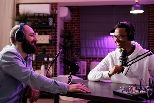 istock Show host recording podcast with guest 1682280921