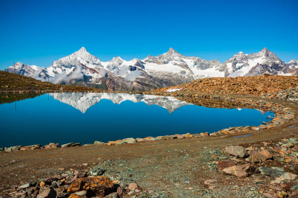 istock Riffelsee lake and Matterhorn, Switzerland 1682283234