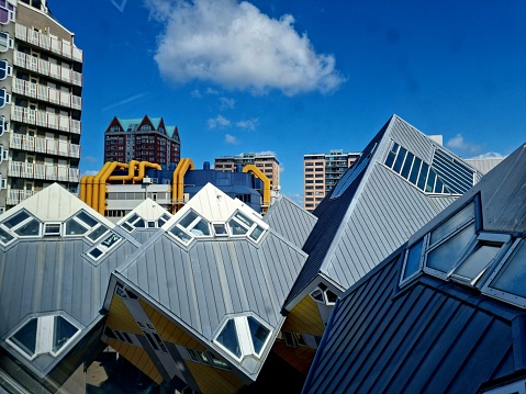 Cube houses are a innovative houses built in Rotterdam in the Netherlands, designed by architect Piet Blom. The buildings where completed in 1984. The image shows the roof of the buildings captured during summer season.