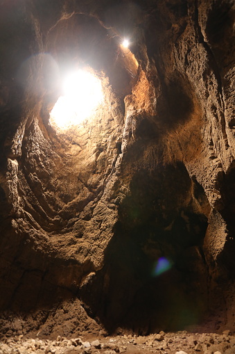 Natural Cave with hole and light coming from the sky in Cadiz province