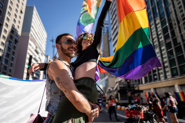 istock Friends embracing at the gay pride parade 1682285925