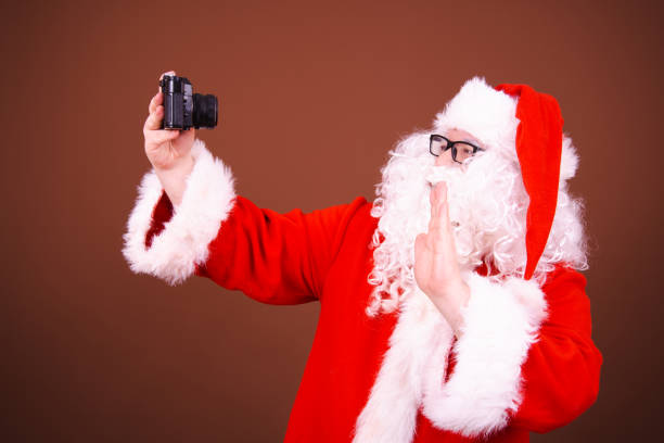 istock Funny Santa Claus is having fun. 1682297159