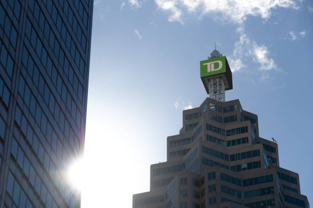 a digital td sign is seen atop of td tower in toronto. - canada trust tower imagens e fotografias de stock