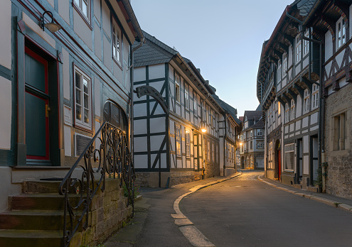 Half-timbered houses in historic district of Goslar in twilight - UNESCO World Heritage