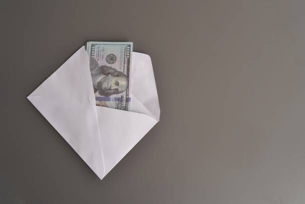 istock Top view image of money inside white envelope. 1682311469