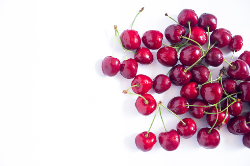 Ripe cherries isolated on a white background. Top view. Copy space.