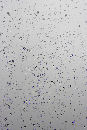 water drops texture. reflection of rain in a window in autumn