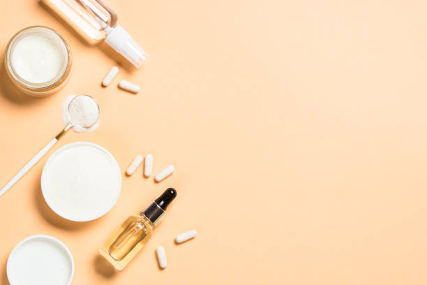 istock Collagen powder dietary supplement at blue. 1682348825