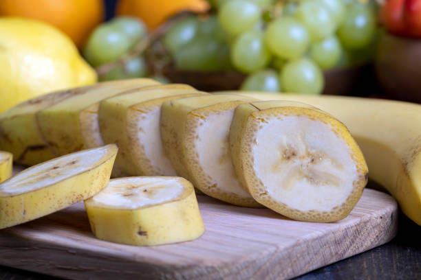 istock Sliced ripe yellow banana, close up 1682354072