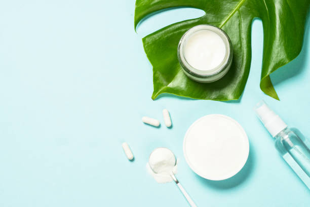 istock Collagen products and cosmetic at blue top view. 1682355162