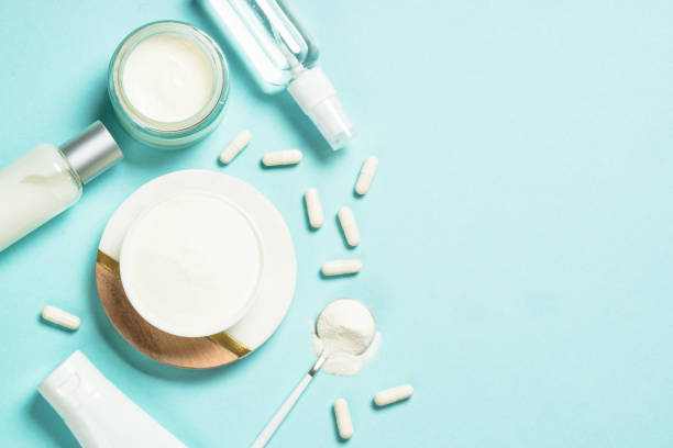 istock Collagen powder dietary supplement at blue background. 1682362508