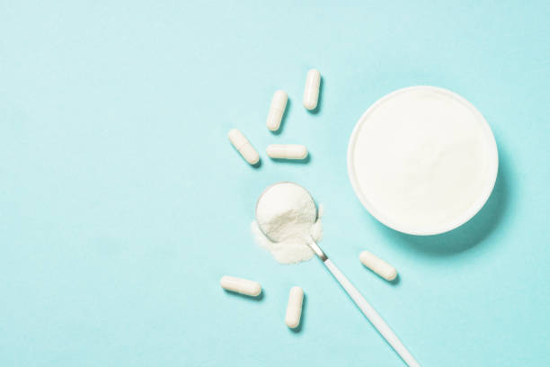 istock Collagen powder dietary supplement at blue. 1682362510