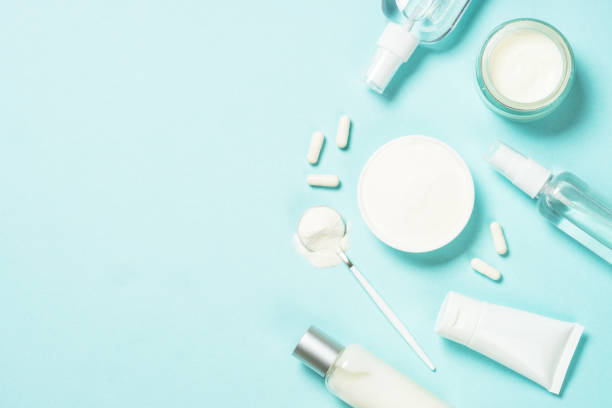 istock Collagen powder dietary supplement at blue background. 1682362511