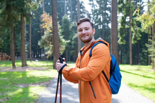 istock A young healthy man in an orange jacket in the forest 1682376969