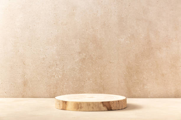 istock Wooden product display podium with blurred nature leaves background. 3D rendering 1682412848