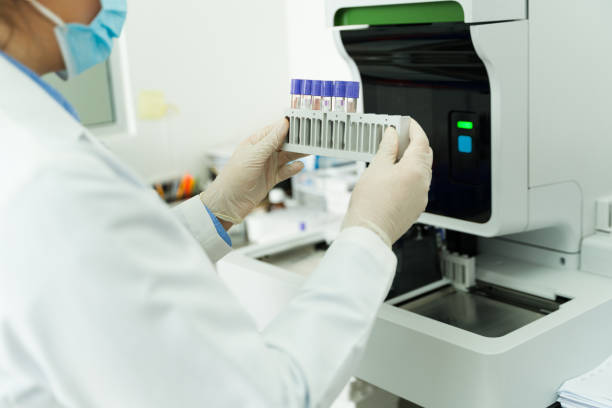 istock Chemist putting test tubes in the lab equipment 1682424148