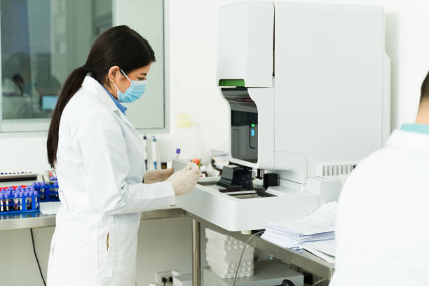 istock Female chemist doing medical test with blood samples 1682427938