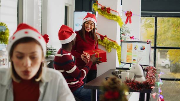 istock Employee surprised by coworker with gift 1682458701