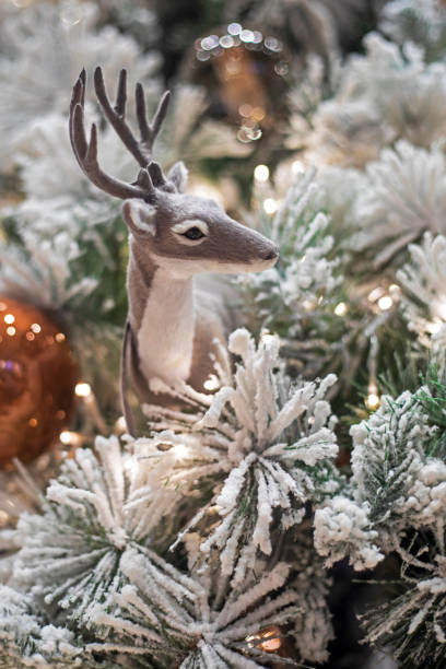istock decorative reindeer on the Christmas tree. Festive background 1682464409
