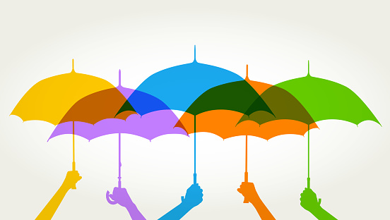 Colourful overlapping silhouettes of umbrellas suggesting protection. Umbrella, brolly, rain, storm, weather, dry, waterproof,  outdoors, storm, water, waterproof, protection, insurance,