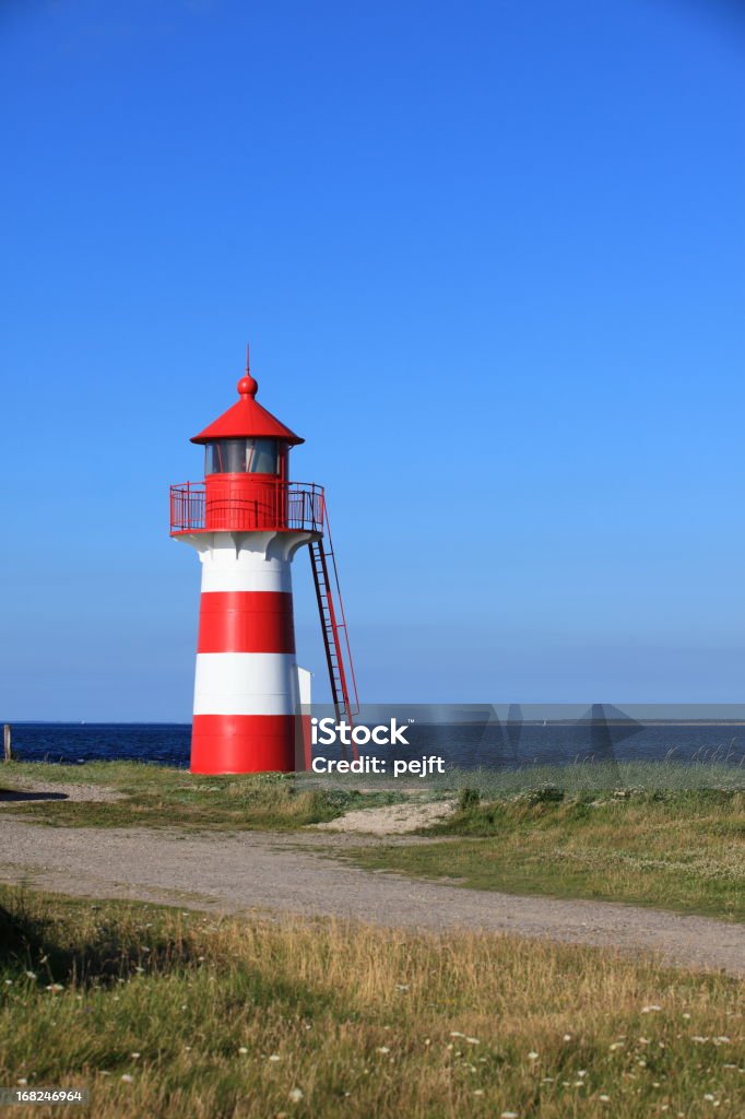 Lighthouse in red and white at Grisetaa Odde Lighthouse Grisetaa Odde by Limfjorden in the north of Jutland, Denmark Bay of Water Stock Photo