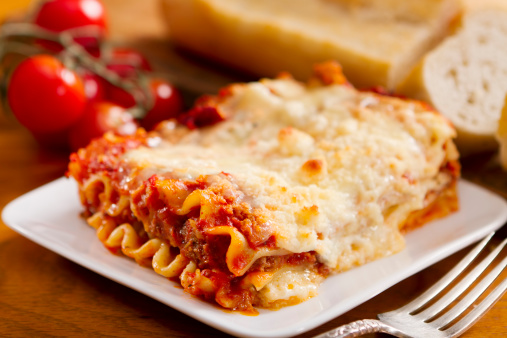 A single serving of freshly made meat and cheese lasagna.