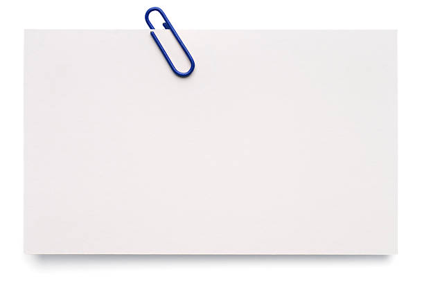 White blank index card A blank index card with a paper clip, isolated on white. clip office supply stock pictures, royalty-free photos & images