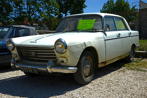 Barjac, France, 08-14-2013\nVintage Peugeot 404 Limosine in bad condition