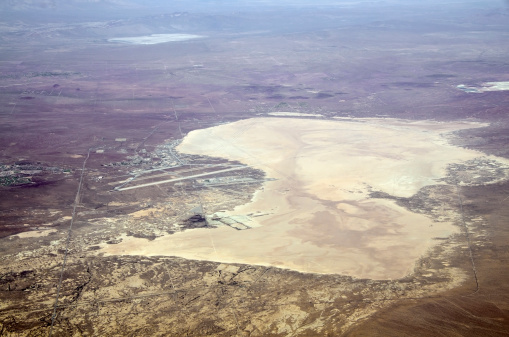 Aerial view of Edwards Air Force Base, California, USA, showing Rogers Dry Lake, a dry lake bed, used as runway for experimental and test vehicles. It was also used as backup landing area for Space Shuttle. Rogers Dry Lake is a National Historic Landmark.