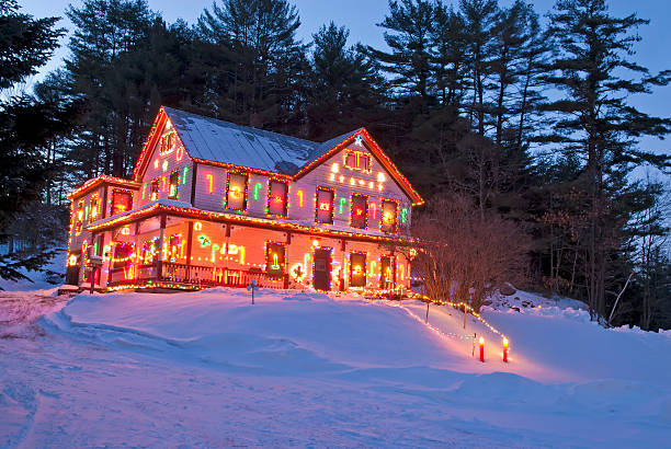 Rural House with Christmas/Winter Season Lights - II Image of the rural house with Christmas lights. Typically these lights stays on all winter. christmas lights house stock pictures, royalty-free photos & images