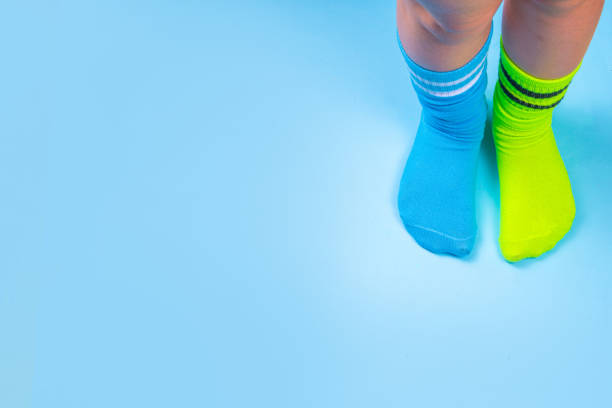 istock Child legs in mismatched socks 1682478171