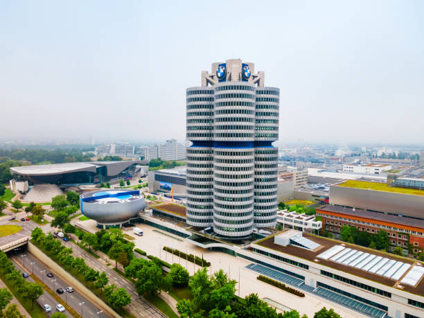 Munich, Germany - January 16, 2020: The BMW Tower, designed by architect Karl Schwanzer, serves as the international headquarters of the German luxury carmaker and is a Munich landmark.