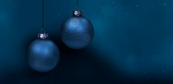 Blue Christmas balls against blue background