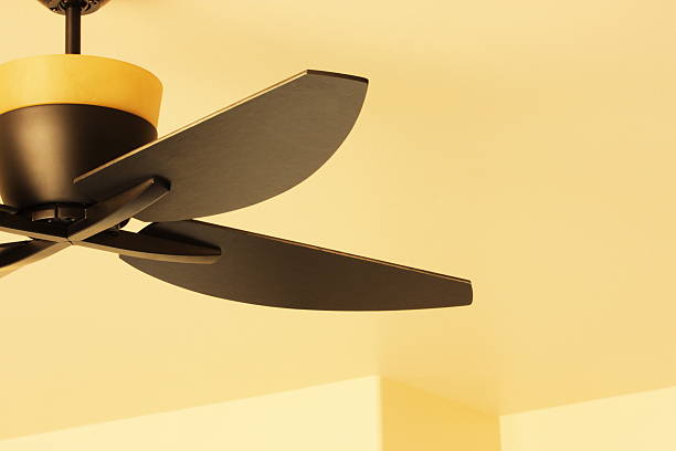 Ceiling Fan Blade Light Fixture Decor Contemporary ceiling fan and blades with light fixture, upscale home interior decor. light fixture stock pictures, royalty-free photos & images