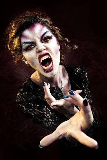 Vampiress Blood Feeding A stock photo of a woman vampire beckoning. vampire woman stock pictures, royalty-free photos & images