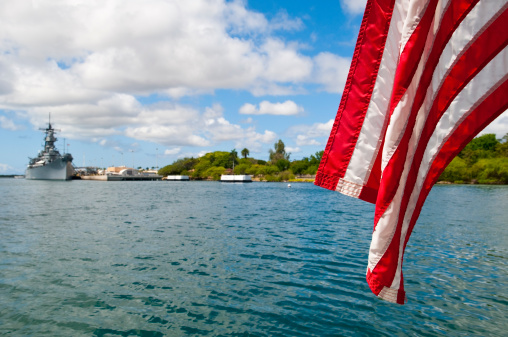 An American aircraft carrier departs a harbour after a weekend in port.