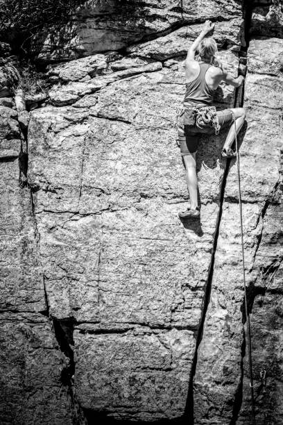 istock Young Woman Rock Climber on a sandstone cliff 168249488