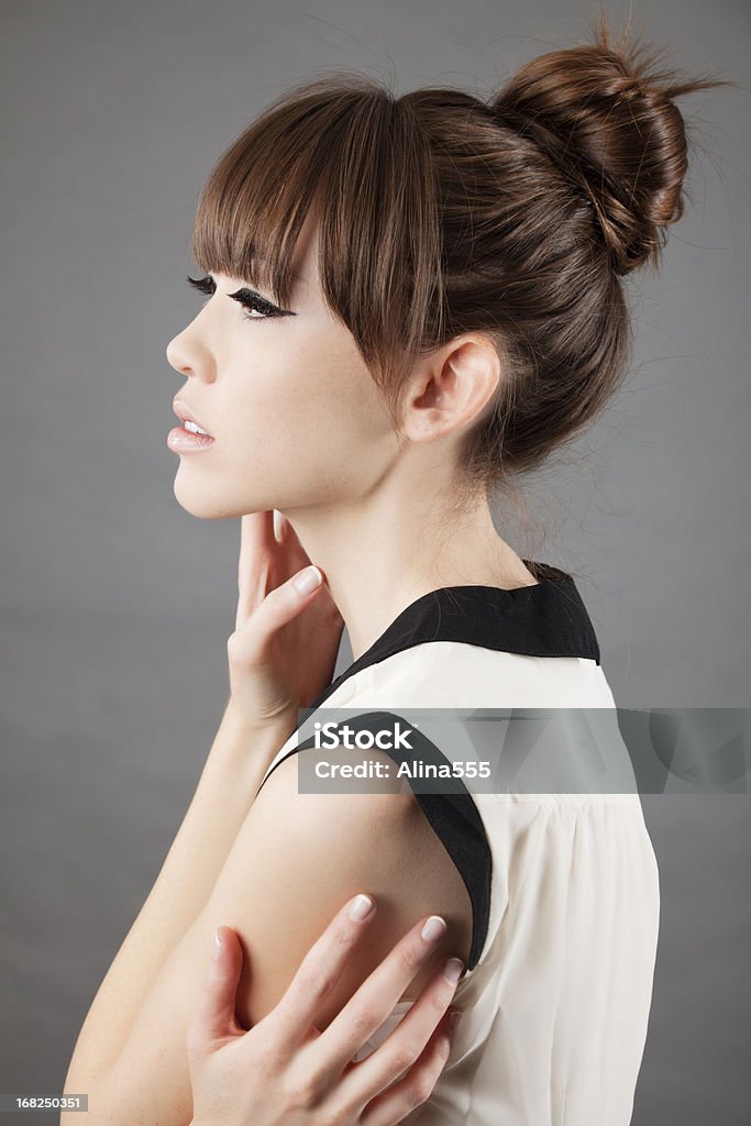 High fashion: profile of an elegant asian model on grey High fashion: profile of an elegant asian model on grey background.  You might also be interested in these: Asian and Indian Ethnicities Stock Photo