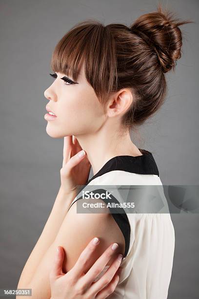 High Fashion Profile Of An Elegant Asian Model On Grey Stock Photo - Download Image Now