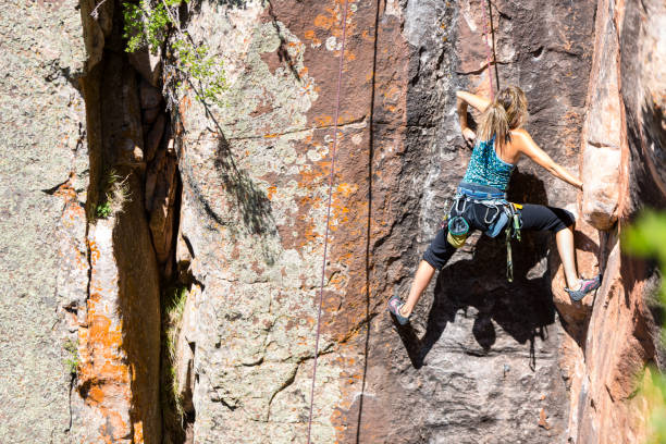 istock Young Woman Rock Climber on a sandstone cliff 168251696