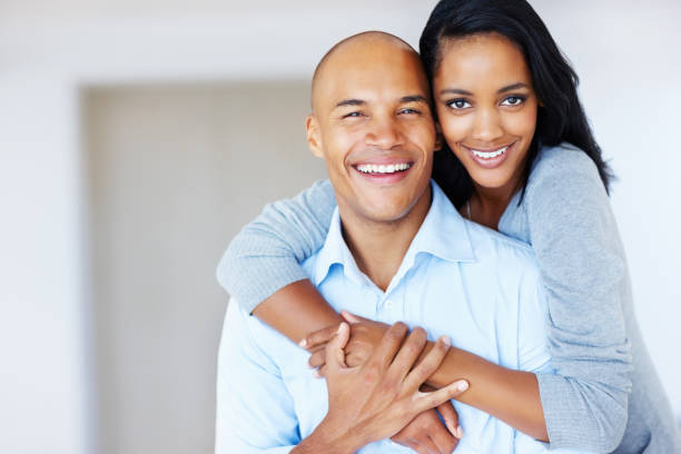 istock Woman embracing man from behind 168251793